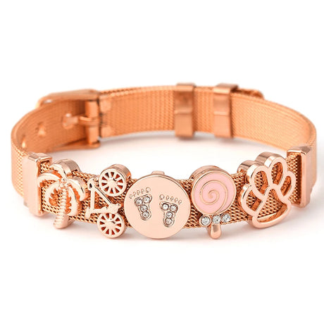 Rose gold dog collar with decorative charms on a white background