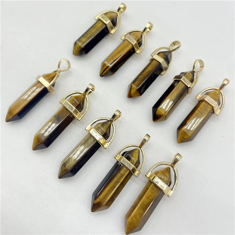 Set of crystal pendants with gold accents on a white background