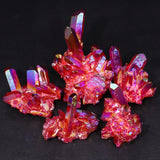 Group of red and pink crystal formations on a black background