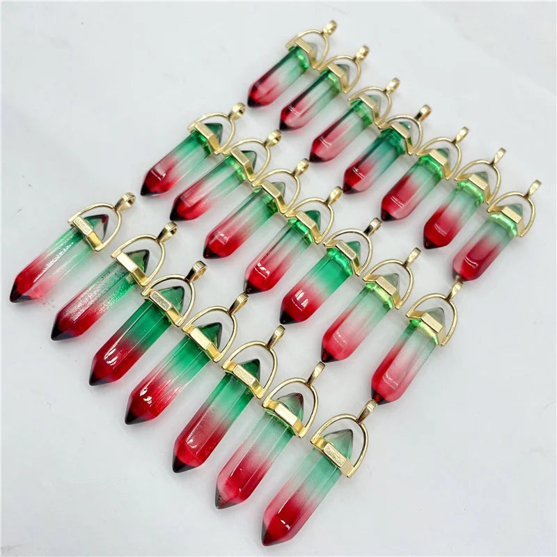 Row of red and green crystal-like pendants with gold accents on a light gray background