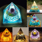 Collage of pyramid-shaped crystal objects with glowing effects on a dark background
