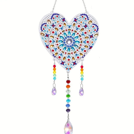 Decorative heart-shaped hanging ornament with colorful beads and crystals on a white background