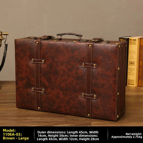 Brown leather suitcase on a wooden surface with dimensions and weight information displayed.