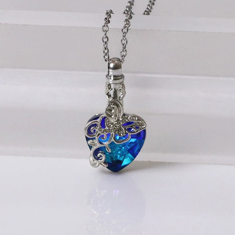 Necklace with a blue heart-shaped pendant on a white background