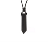 Black crystal pendant necklace on a white background with Czia Jewels logo.