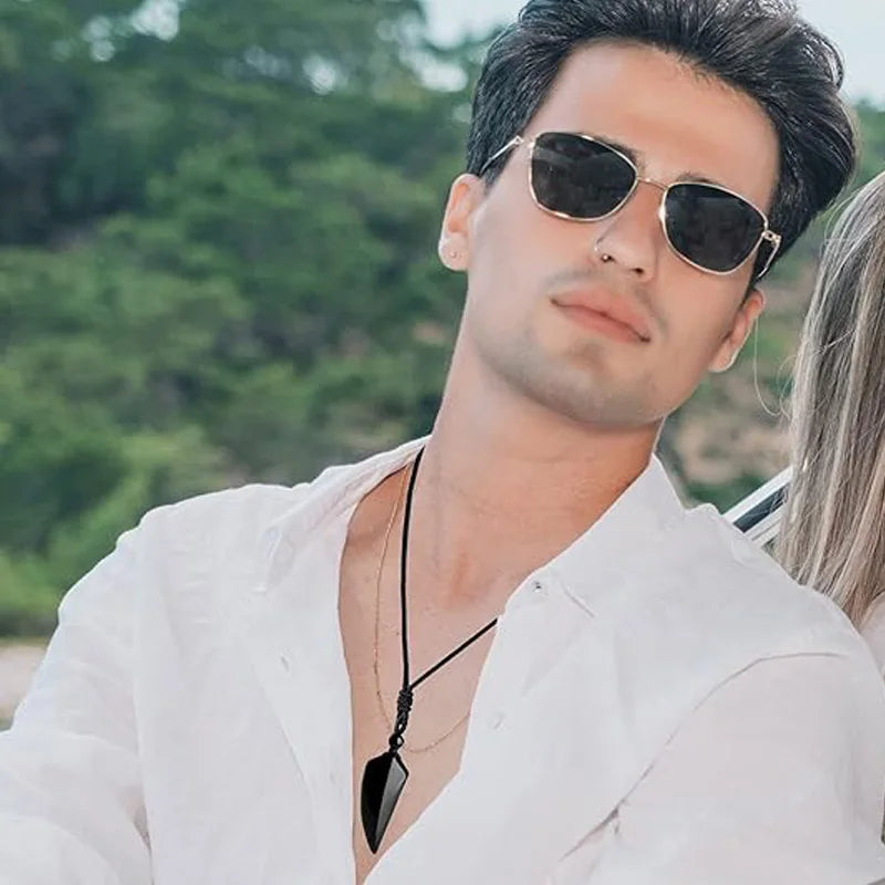 Man wearing sunglasses with a blurred natural background