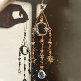 Decorative hanging with celestial elements and beads on a textured background
