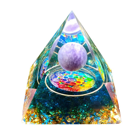 Colorful pyramid-shaped crystal with a purple sphere inside on a white background