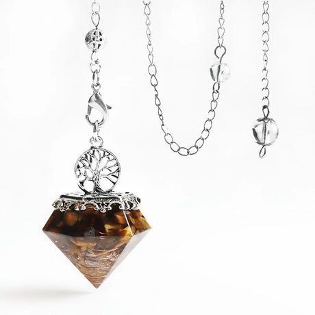 Necklace with a brown pendant and silver chain on a white background