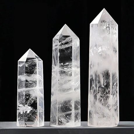 Three crystal towers of varying sizes on a black background