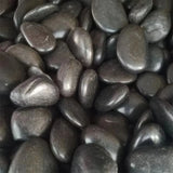Close-up of dark gray pebbles