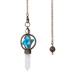 Necklace with blue gemstone, clear crystal, and bronze elements on a white background