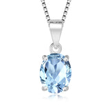 Silver necklace with a blue gemstone pendant on a white background