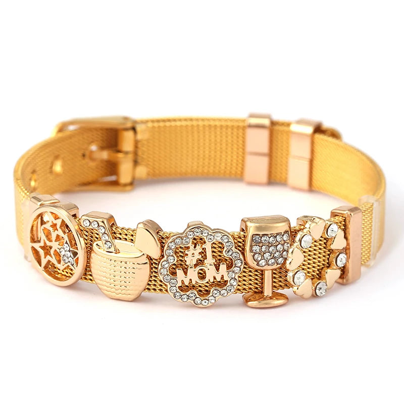 Gold bracelet with various charms on a white background