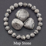 Map stone bracelet with stones in the center on a dark background