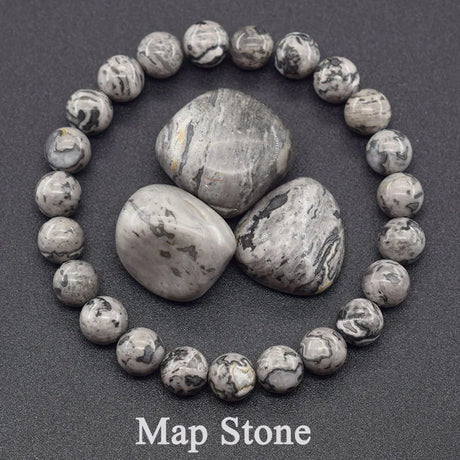 Map stone bracelet with stones in the center on a dark background