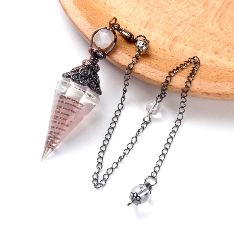 Crystal pendant necklace with chain on a wooden surface