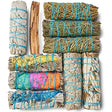 Collection of smudge sticks tied with blue string on a white background