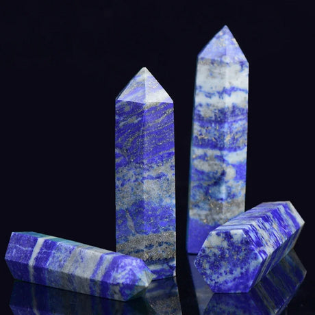 Blue and white striped crystal points on a black background