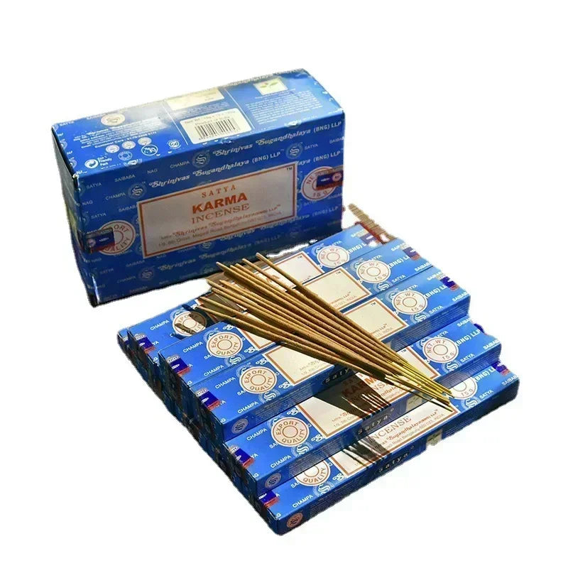 Scented sticks with blue boxes labeled 'Karma' on a white background