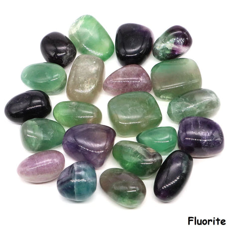 Collection of fluorite crystals in various colors on a white background
