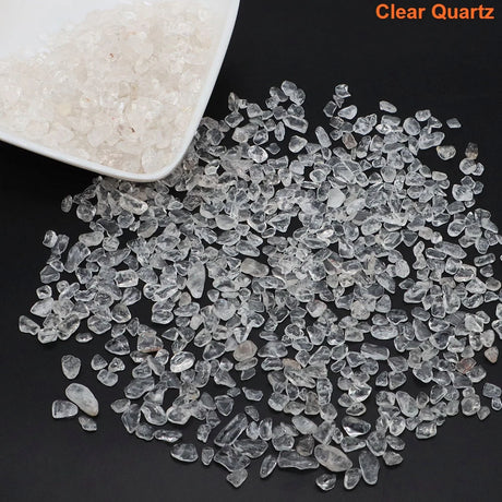 Clear quartz stones on a black surface with 'Clear Quartz' text.