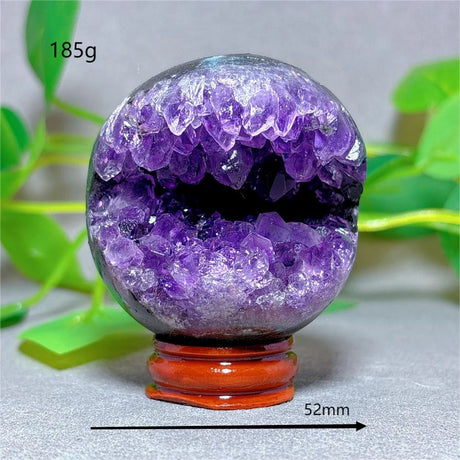 Amethyst geode crystal ball on a stand with measurement details
