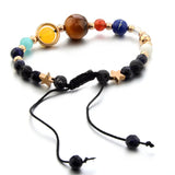 Multicolored beaded bracelet with black cord on a white background