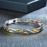 Bracelet with metal and gold braided design on a textured surface