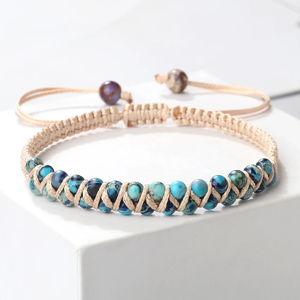 Beaded choker necklace with blue stones on a white surface
