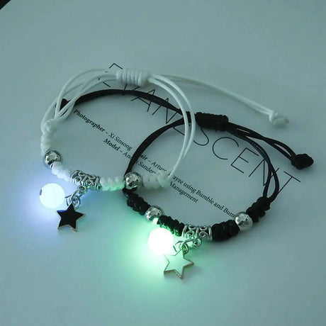 Glowing bracelets with star charms on a white background