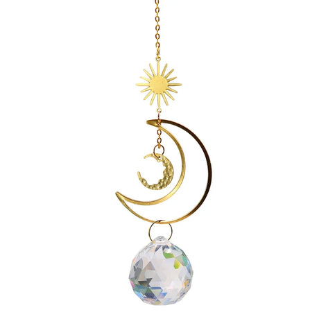 Decorative hanging ornament with sun, moon, and crystal ball on a white background