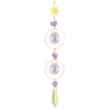 Decorative hanging ornament with crystals and a sun-like top on a white background