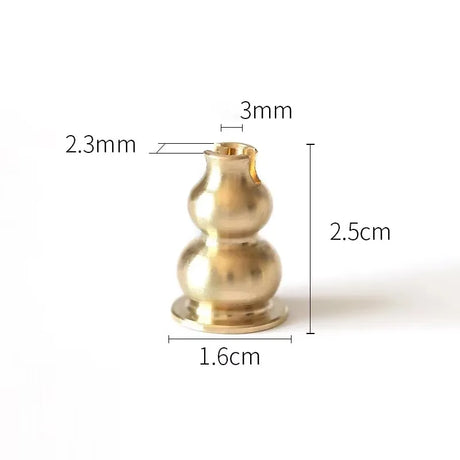 Brass candle holder with measurements on a white background