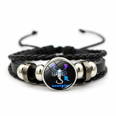 Black braided bracelet with Scorpio zodiac symbol charm on a white background
