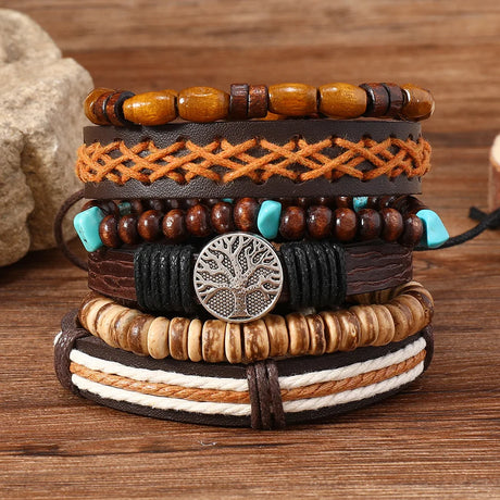 Stack of multi-layered bracelets with various designs on a wooden surface