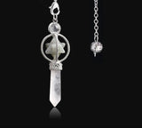 Silver pendant necklace with star design and crystal on a black background