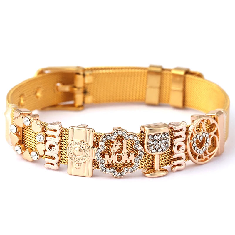 Gold dog collar with decorative charms on a white background