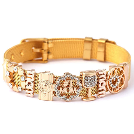Gold dog collar with decorative charms on a white background