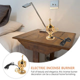Electric incense burner on a wooden table next to a lamp and pillows, with an inset showing the product.
