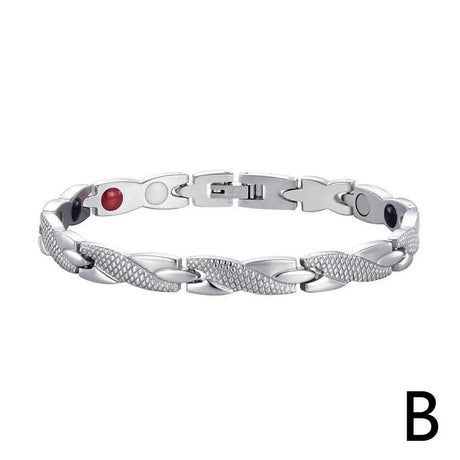Silver bracelet with red and black stones on a white background