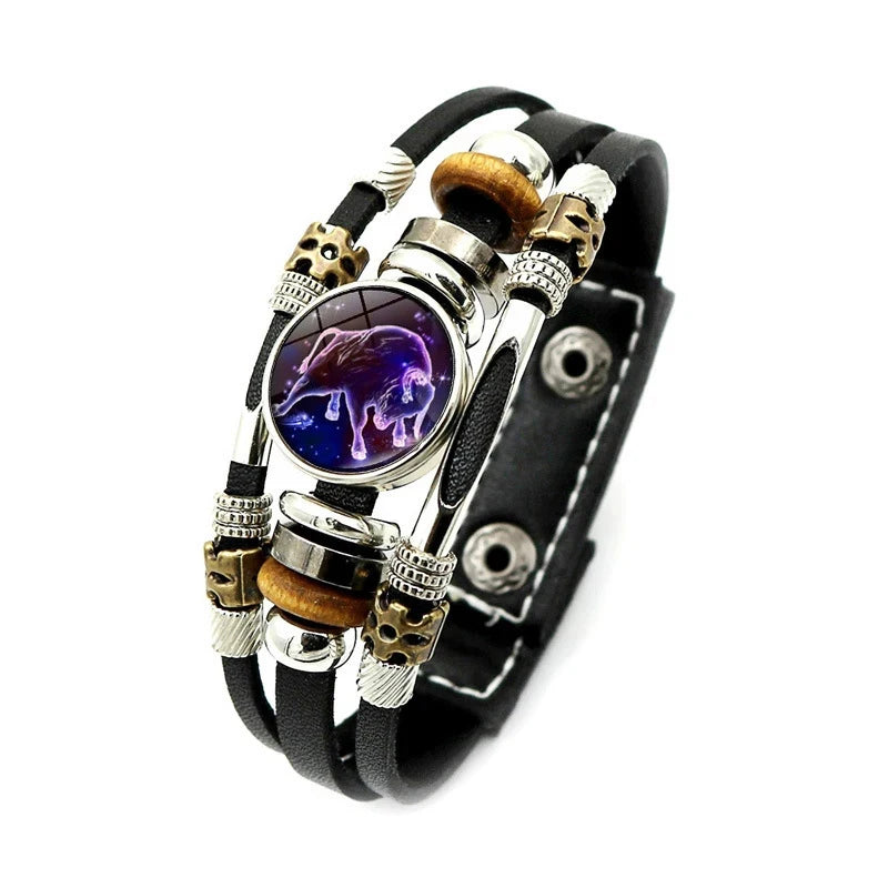 Multistrand bracelet with purple stone and skull beads on a white background