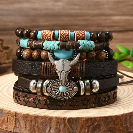 Stack of leather and beaded bracelets with decorative elements on a wooden surface