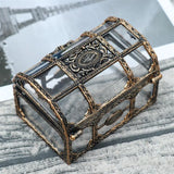Decorative glass box with bronze frame on a textured surface