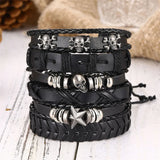 Stack of black leather bracelets with skull and star charms on a light wooden surface.