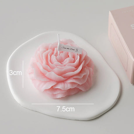 Pink rose-shaped soap on a white heart-shaped stand with measurements and 'Save the Date' tag.