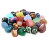 Assorted colorful gemstones on a white background