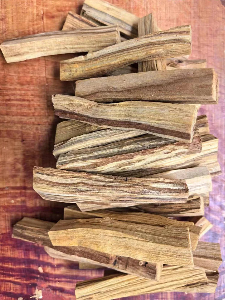 Stack of wooden sticks on a wooden surface