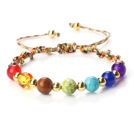 Colorful beaded bracelet with a variety of beads on a white background
