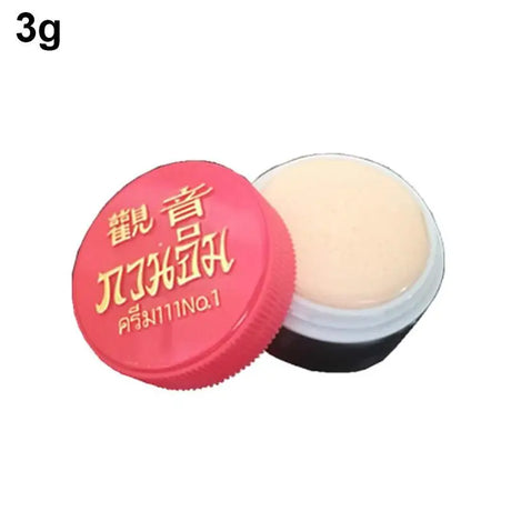 Small container with pink lid and white cream inside, labeled '3g'.
